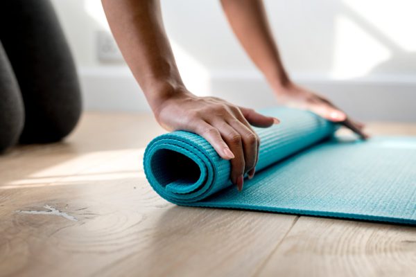 Yoga Mat Being Rolled Up